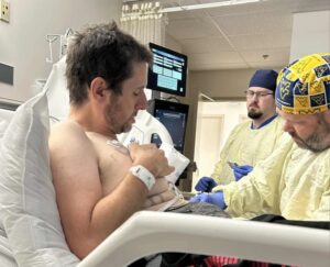 My brother, Brad in the hospital, bravely fighting NKT cell lymphoma. Despite the challenges of his diagnosis and treatment, his strength and resilience shine through each day.